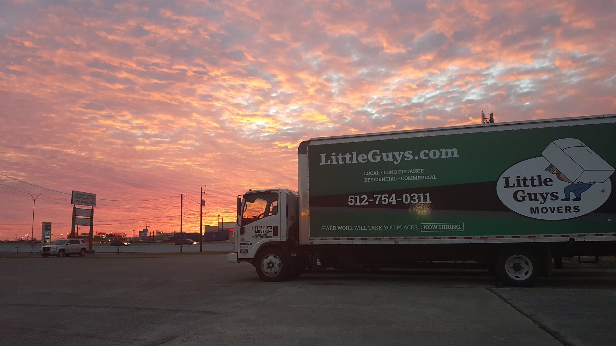 A Little Guys truck parked in a lot during a gorgeous sunset