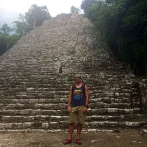 Mover standing in front of ancient landmark