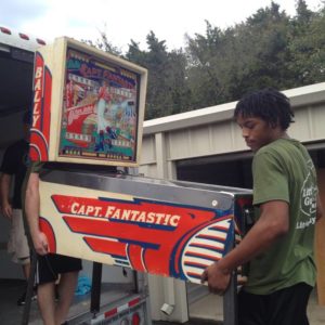 Murfreesboro Little Guys moving a pinball machine