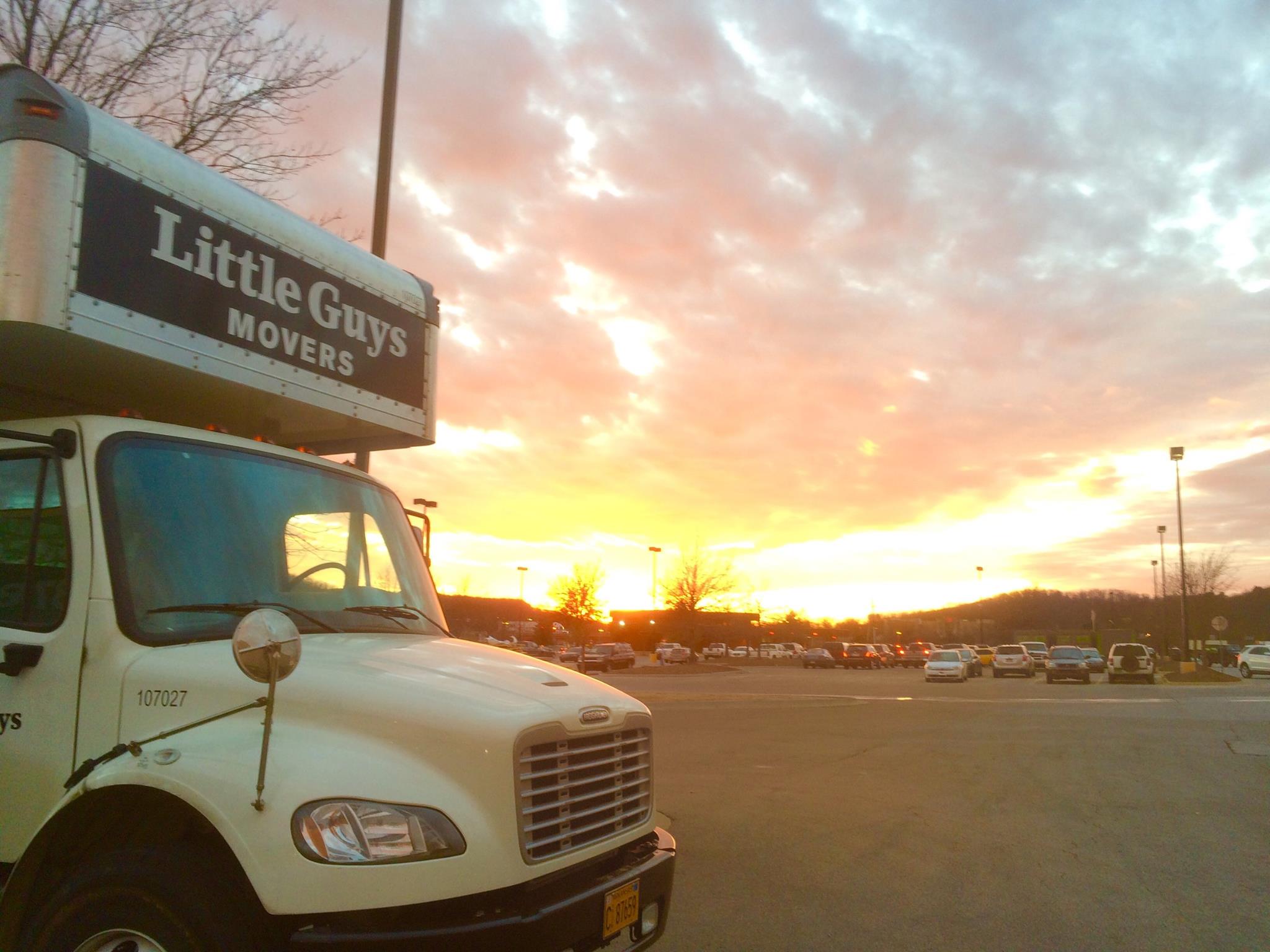 Little Guys Movers truck with sunset