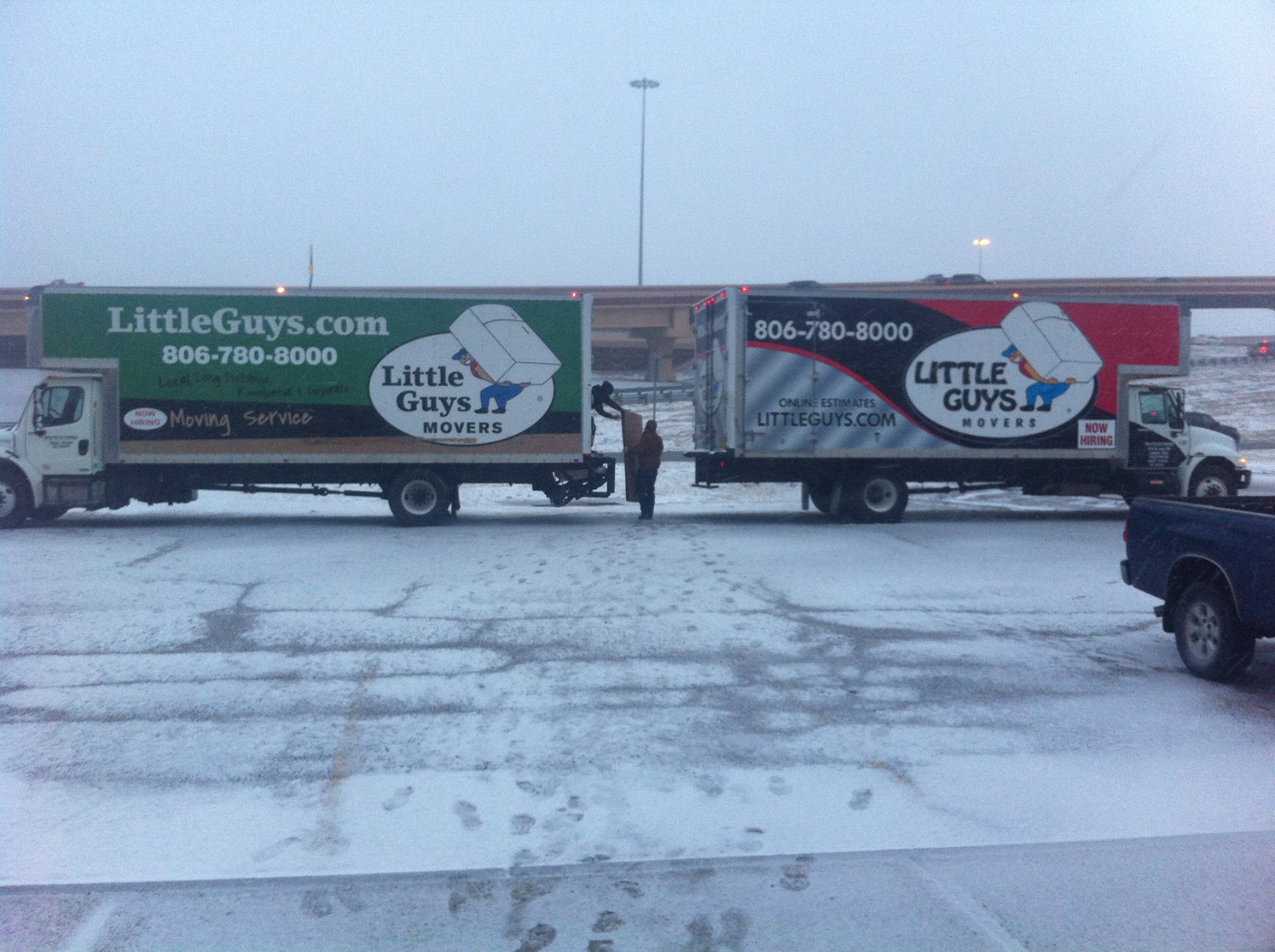 Two Little Guys Movers trucks in Lubbock snow