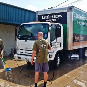 Little Guys washing trucks in Denton