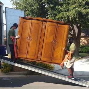Little Guys Movers loading furniture into a truck