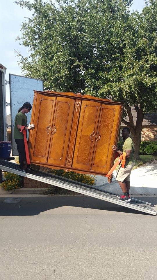 Little Guys Movers loading furniture into a truck