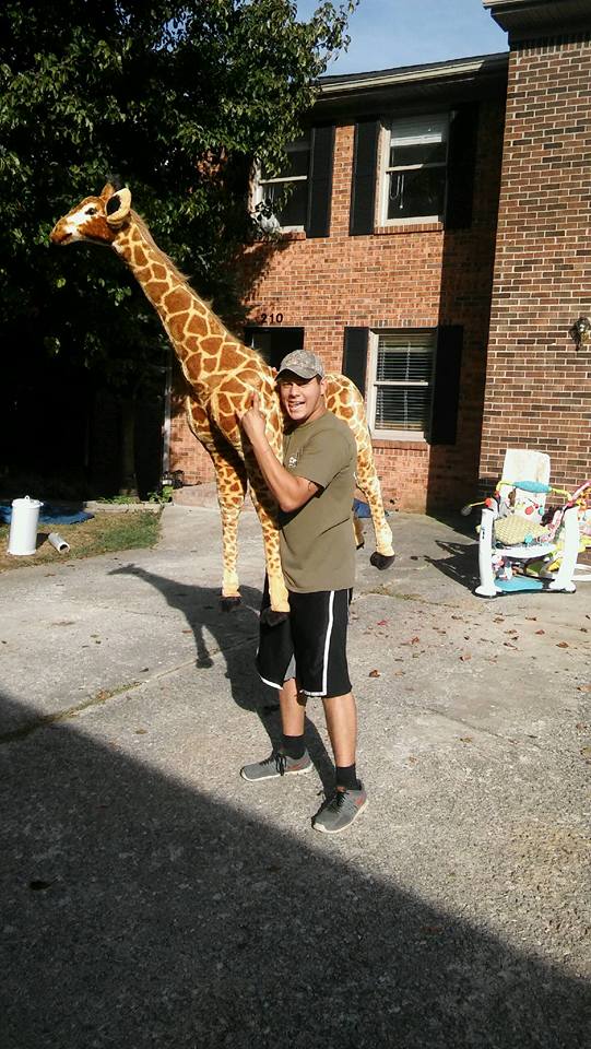 A Lexington Little Guy carrying a giraffe?