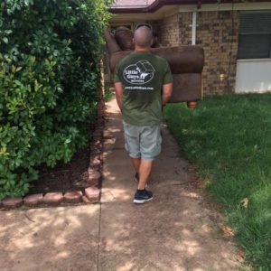 Movers carrying furniture