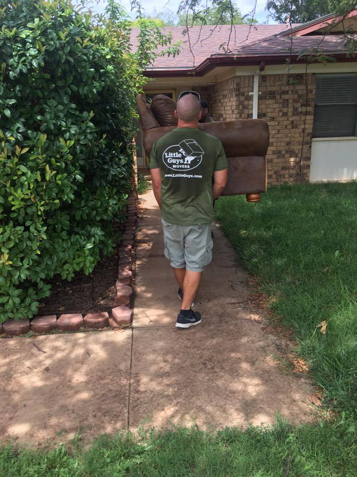Movers carrying furniture.