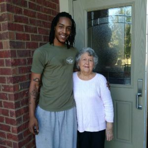 A Little Guy poses with a senior customer