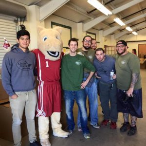 Group of movers posing with a mascot