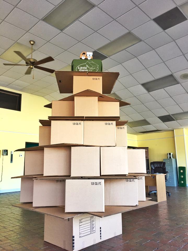A Christmas tree made out of stacked moving boxes