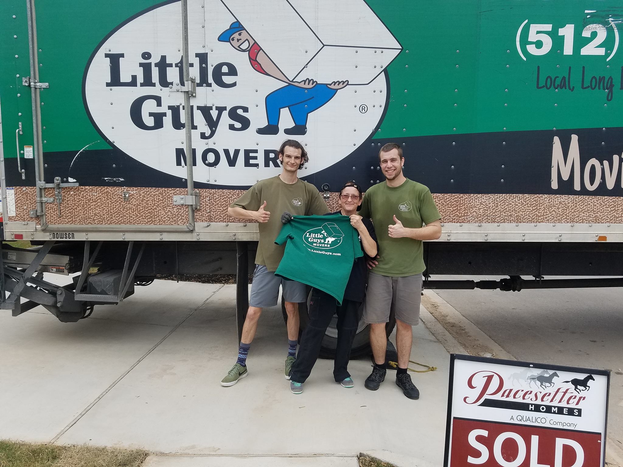 san marcos little guys movers with customer in front of truck