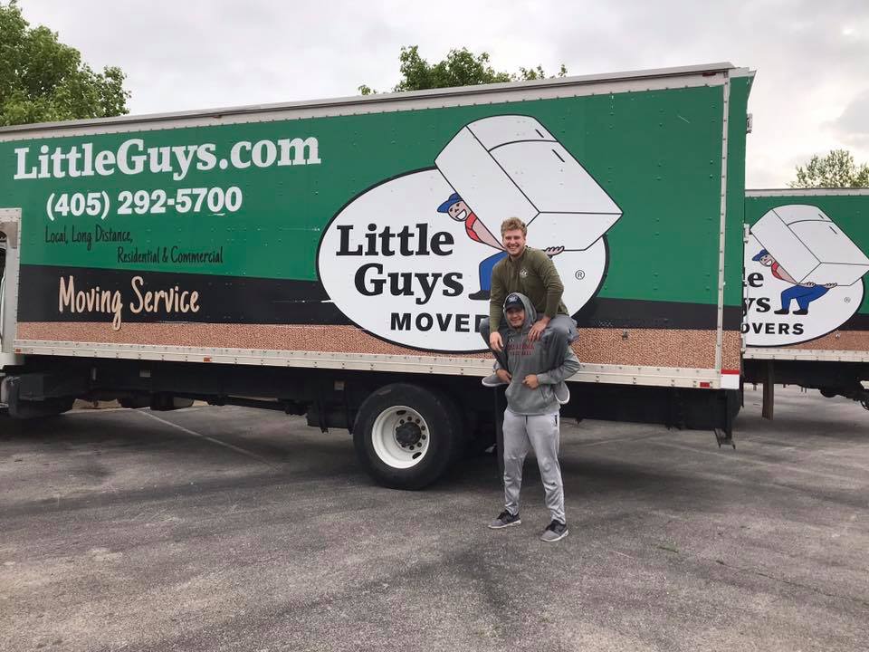two movers in front of truck