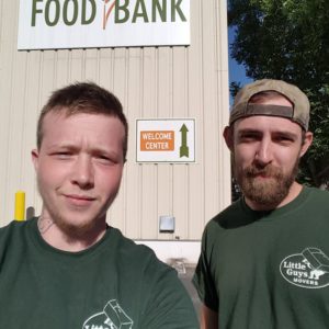 Little Guys Movers making a food bank donation