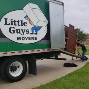 Two Little Guys with furniture and truck