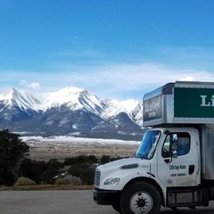 moving truck in front of mountain