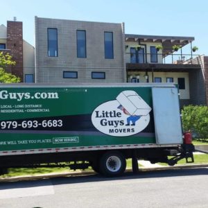 college station apartment movers truck outside building