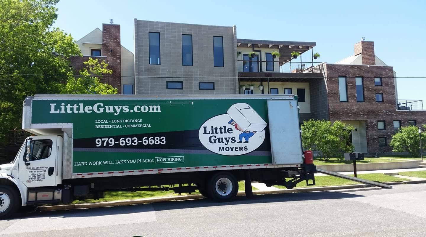 college station apartment movers truck outside building