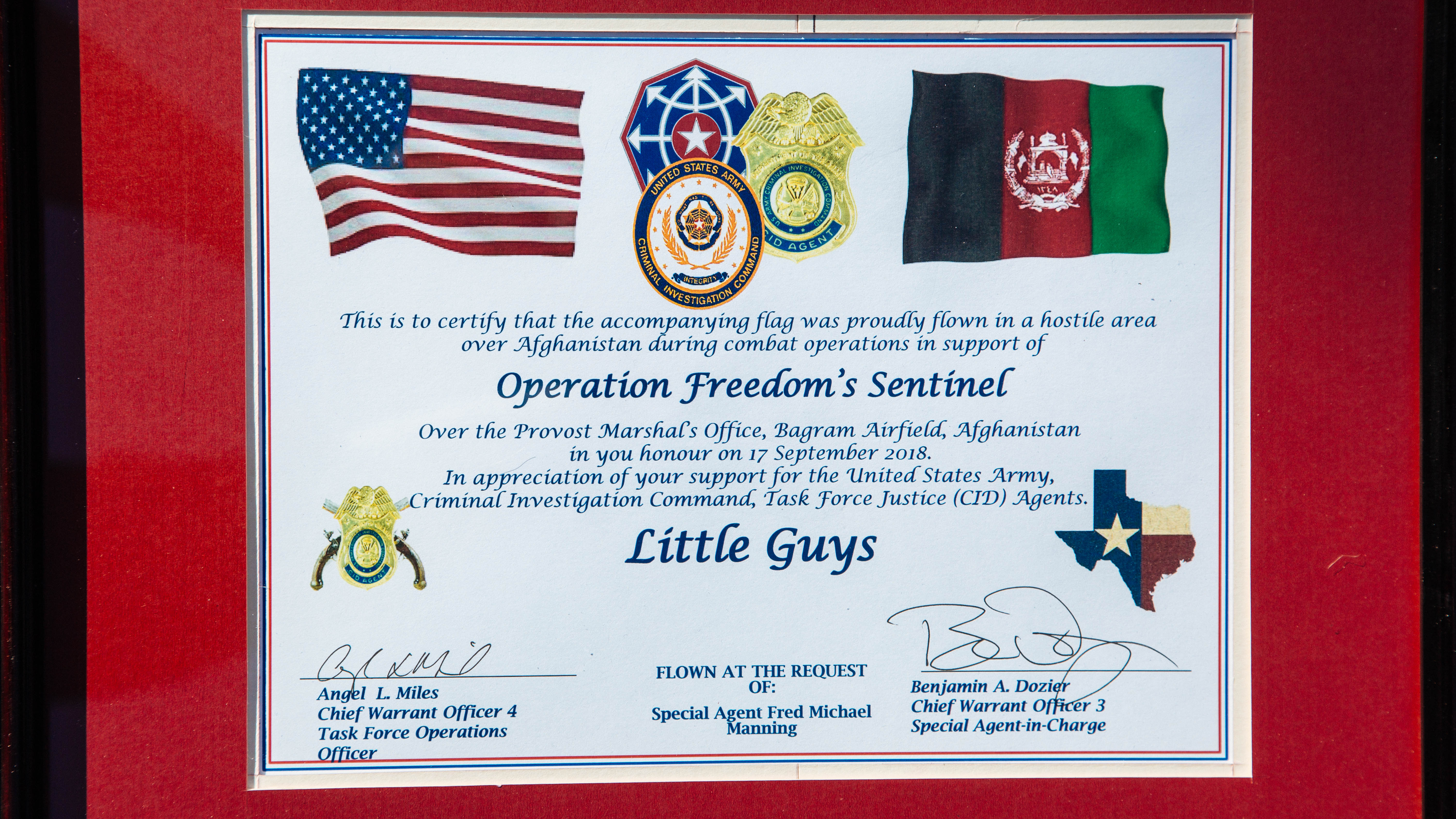 certificate reading that the accompanying Operation Freedoms Sentinel flag is dedicated in honor of Little Guys Movers