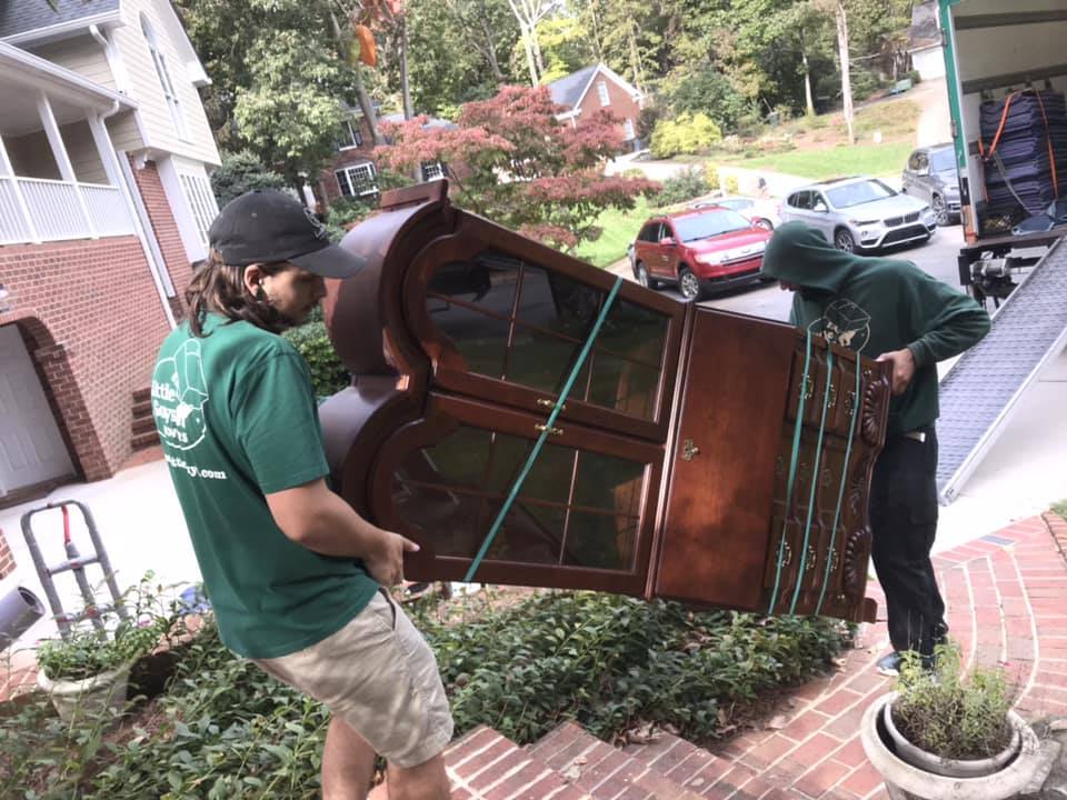 expert greensboro movers carrying a china cabinet