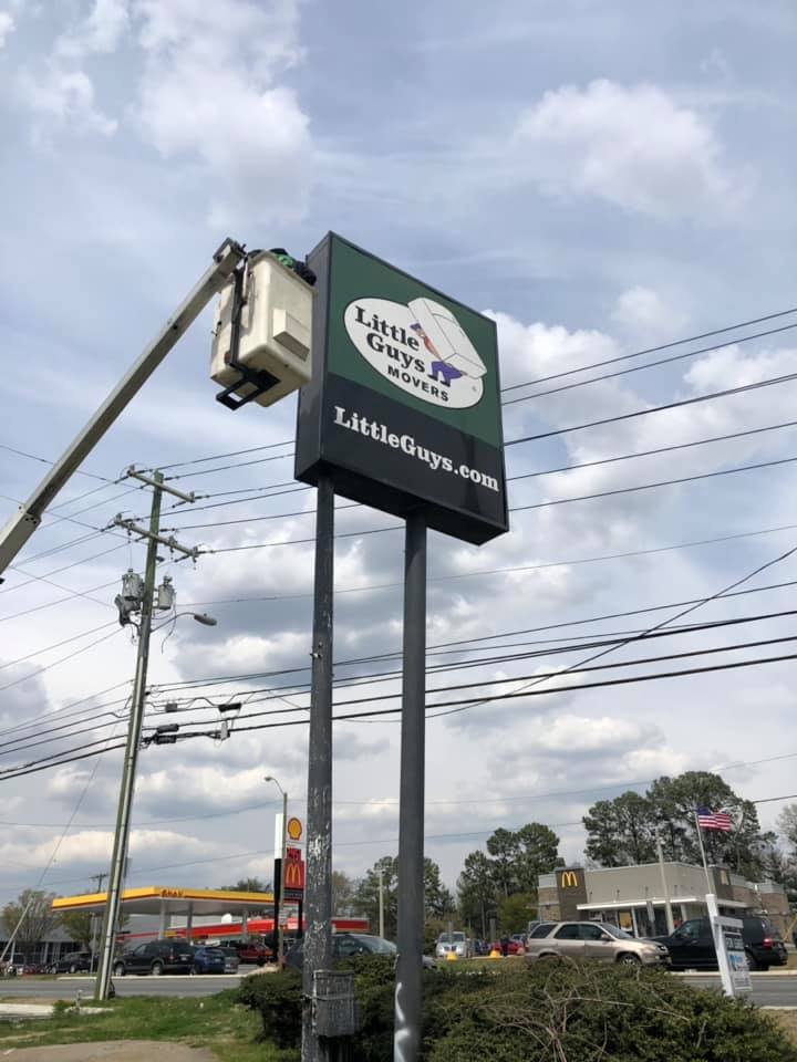 Little Guys Movers Greensboro sign being removed