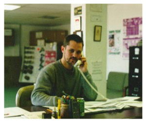Co-Owner, Chris Hawley works the desk in 2001.