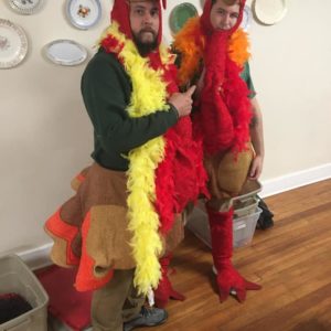 Little Guys Movers dressed as turkeys for Turkeys Tackling Hunger