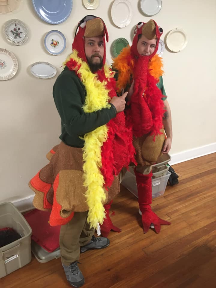 Little Guys Movers dressed as turkeys for Turkeys Tackling Hunger