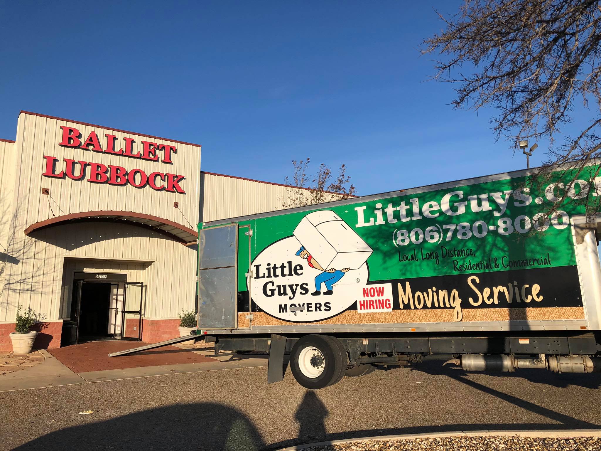 Little Guys Movers truck in front of Ballet Lubbock building