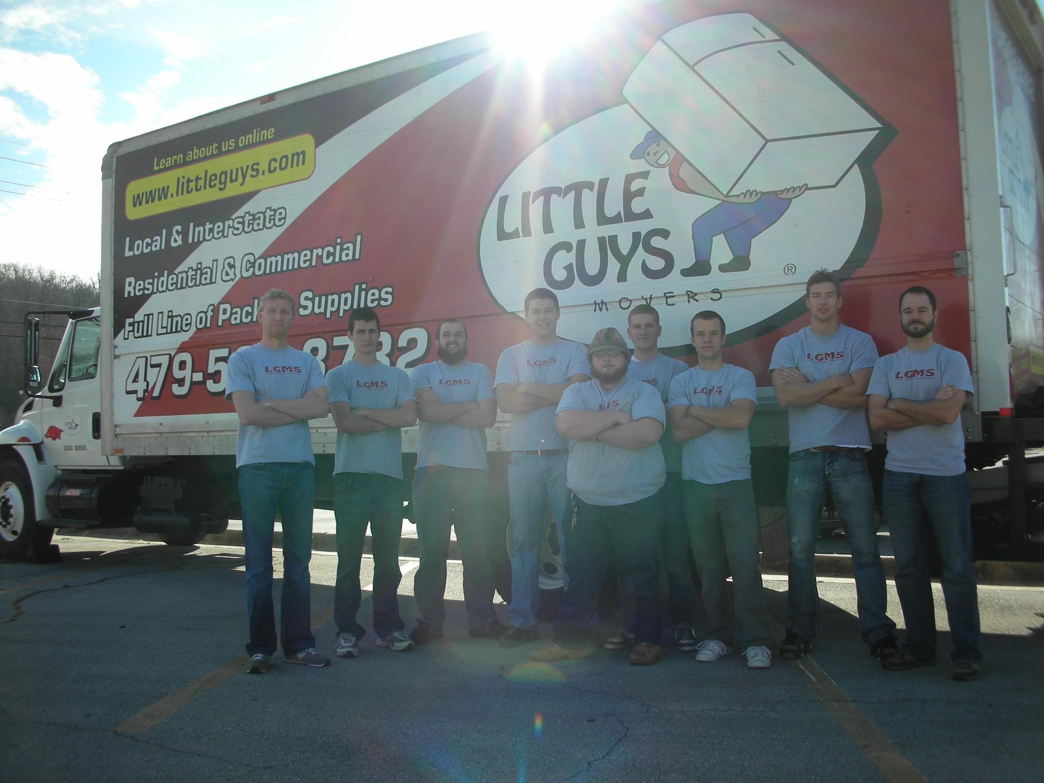 Original Fayetteville Little Guys Movers standing in front of moving truck