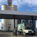 Round Rock movers truck in front of silo