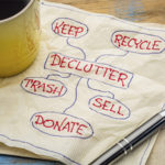 Different synonyms for "declutter" written on a napkin.