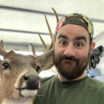 Austin Little Guys mover carefully packs deer taxidermy into moving truck.