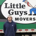 A Little Guys mover in front of a moving truck in Fayetteville/