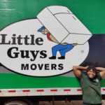 A Little Guys mover in front of a moving truck in Lubbock, TX.