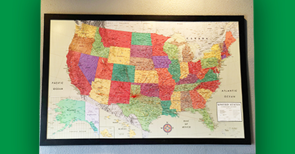 A wall map shows all of the locations Little Guys Lubbock has traveled to.