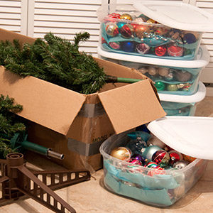 Boxes of holiday decor and ornaments spill out onto the floor