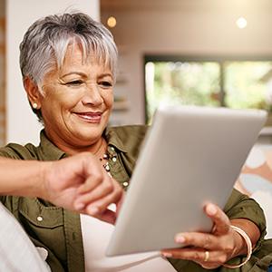 Woman searches for moving services on tablet