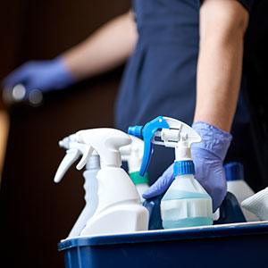 Cleaning bucket and cleaning solution in bottles — ready to clean for a big move.