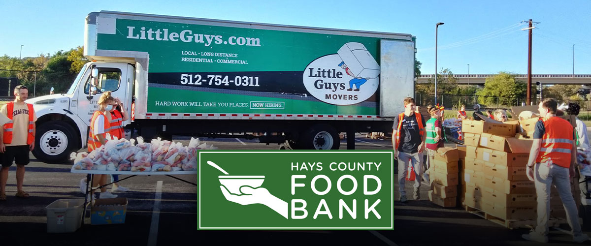 A Little Guys Movers moving truck transports hundreds of meals for Turkeys Tackling Hunger in Hays County.