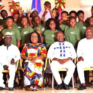 Members of the Global Evangelical Church in Ghana celebrate a drum kit donated by Little Guys Movers.